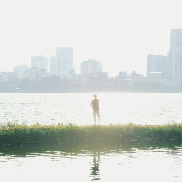 A serene outdoor scene with calm water and soft morning light.